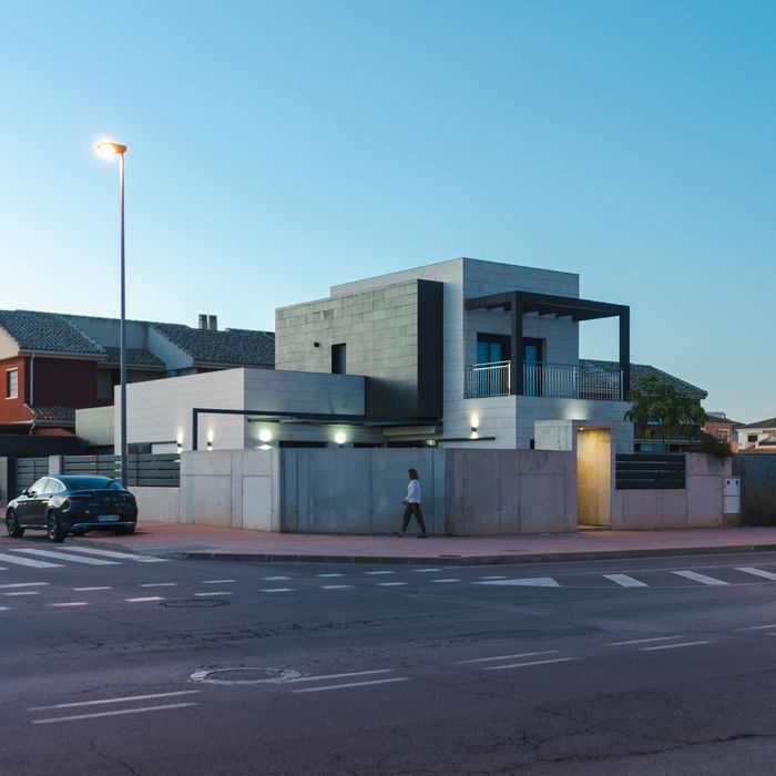 Contemporary house with street view in San Javier, Spain during evening.