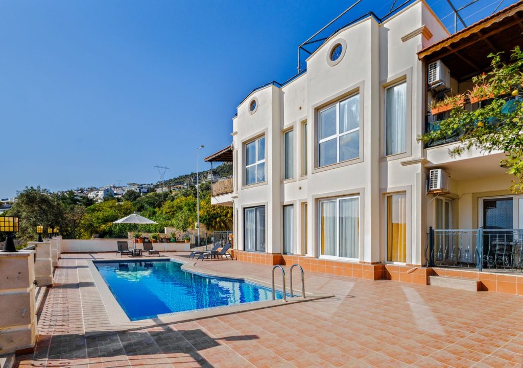 Elegant villa with a private pool and scenic surroundings, perfect for relaxation and travel retreats.